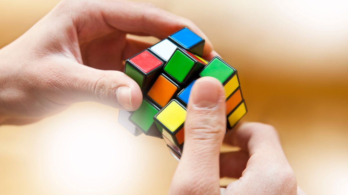 A person solving a Rubik's cube.